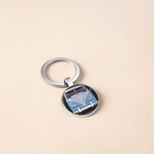 Vintage silver keychain featuring a classic peace van illustration on a round pendant