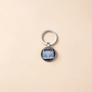 Vintage silver peace sign keychain with blue retro bus illustration pendant for car keys