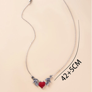 Gothic demon wing necklace with a red heart pendant and 42+5cm chain measurements