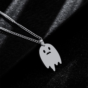 Macro detail of polished ghost pendant with sparkling black starry background