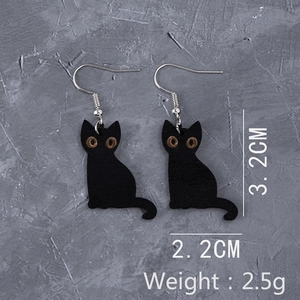 Detail view of black cat wooden earrings showing 3.2cm height and 2.2cm width dimensions