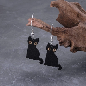 Gothic black cat wooden drop earrings with silver hooks on minimalist branch display