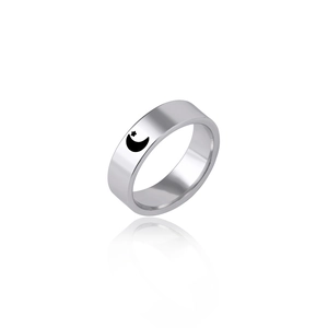 Detail view of a silver titanium steel ring featuring celestial moon and star motifs