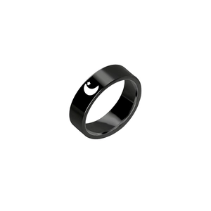 Detail shot of black titanium steel ring featuring hollow star and moon cutout designs