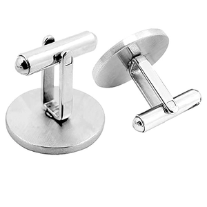 Detail of silver round cufflinks showing brushed texture and T-bar swivel closure