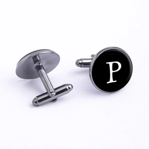 Detail view of gunmetal cufflink showing swivel T-bar back and letter P monogram