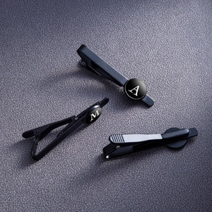 Three-piece set of matte black stainless steel necktie clips with white alphabet letters