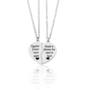 Together Forever heart puzzle necklaces set with engraved silver pendant on white background
