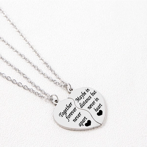 Polished heart puzzle pendant necklace with engraved emotional text on white background