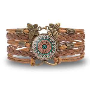 Detail of bohemian layered leather bracelet with mandala glass charm and infinity pendant
