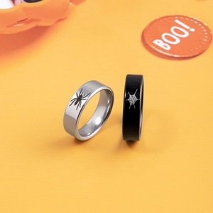 Halloween stainless steel spider and web couple ring set on festive orange background