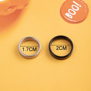 Detail showing 1.7cm and 2cm inner diameter sizes for silver and black steel rings