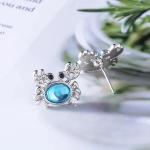 Cute crab stud earrings with blue crystal and white cubic zirconia in silver-plated metal