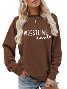 Close-up of ribbed crewneck and Wrestling Aunt lettering on chocolate brown sweatshirt