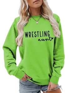 Detail of neon green crewneck sweatshirt with black WRESTLING aunt text print