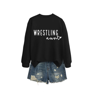 Women's black Wrestling Aunt sweatshirt paired with distressed blue denim shorts
