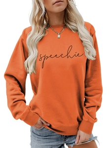 Detail of orange crewneck sweatshirt featuring black speechie text and soft cotton texture
