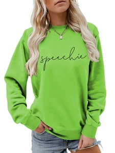 Close-up of speechie print on neon green sweatshirt with ribbed cuffs and crew neck