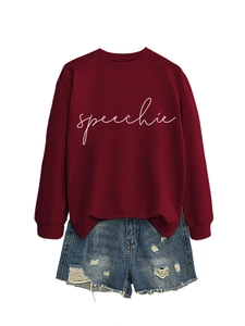 Close-up of speechie text print on burgundy sweatshirt and ripped denim shorts set