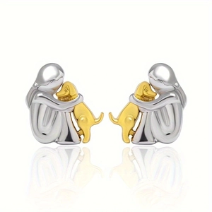 Polished silver and gold girl hugging dog stud earrings with a sleek mirror finish