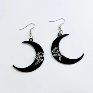 Gothic style black crescent moon earrings with silver rose design for a vintage aesthetic