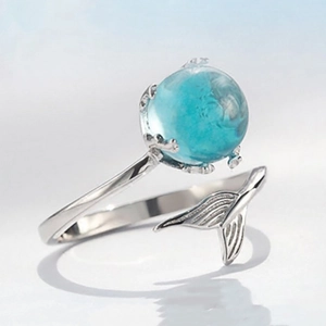 Adjustable S925 silver mermaid tail ring featuring a large sea blue opal stone