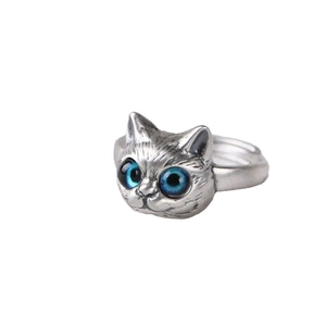 Vintage style cat head ring with blue eyes on white background for women