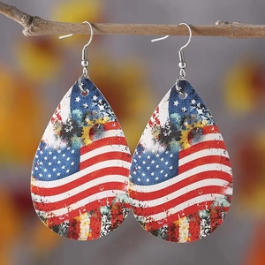 Detail of teardrop earrings with vintage American flag and sunflower print on wood