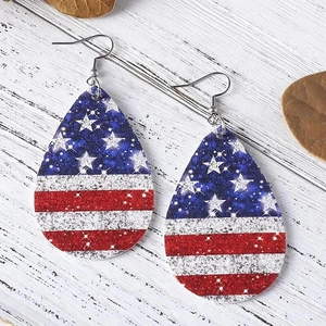Independence Day teardrop earrings with American flag glitter pattern on rustic wood