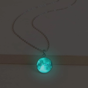 Luminous moon pendant necklace with glowing blue effect on a silver link chain