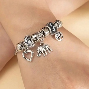 Pandora style bracelet with heart elephant and tree of life charms on snake chain