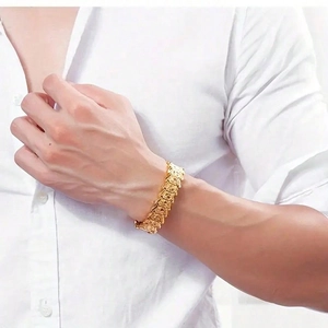 Men's hip hop gold bracelet with thick geometric engraved square links on white shirt