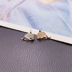 Elegant dolphin stud earrings with white cat-eye stones and golden metal finish
