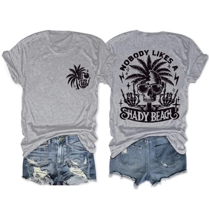 Front and back detail of grey t-shirt featuring tropical skull graphics and palm trees