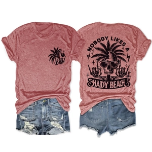 Detail of grey crewneck T-shirt with vintage skull print and distressed denim shorts