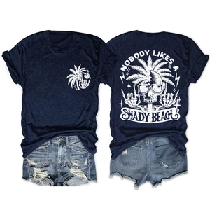 Detail of navy cotton T-shirt featuring Nobody Likes A Shady Beach skull print and denim shorts