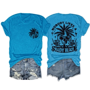 Detail view of blue cotton t-shirt with skull graphic and distressed denim shorts set