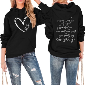 Front and back view of black hoodie with 'let them' heart print and motivational text