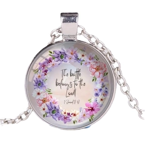 Biblical glass pendant necklace with 'The battle belongs to the Lord' text on white background