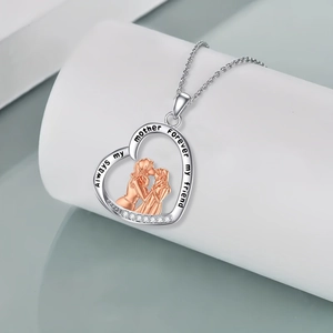 Two-tone heart necklace with mother-daughter silhouette and sparkling crystals for Mom