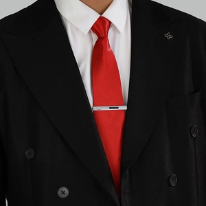 Sleek silver and black enamel business tie clip for men on a red silk tie and black suit