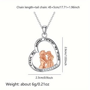 Silver heart necklace with MOM engraving and rose gold mother-daughter pendant detail