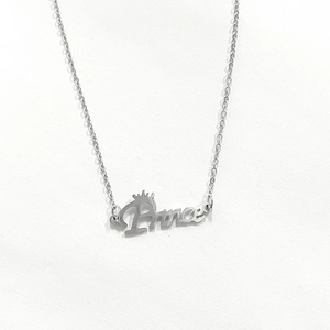 Silver stainless steel Prince letter pendant necklace with crown on white background