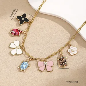 Detail view of multi-pendant ocean style necklace with sizes and weight dimensions