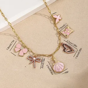 Detail view of gold ocean charms necklace showing 42+5cm length and 17.5g weight info