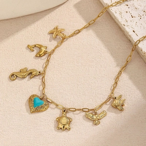 Collana in acciaio dorato con ciondoli oceanici come stella marina e delfino