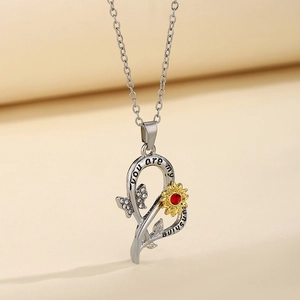 Two-tone sunflower heart necklace with red gem and you are my sunshine engraving