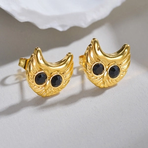 Golden owl stud earrings with black gemstone eyes and detailed feather texture