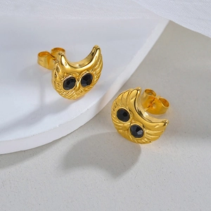 Minimalist 18K gold owl stud earrings featuring black zircon eyes and feather textures