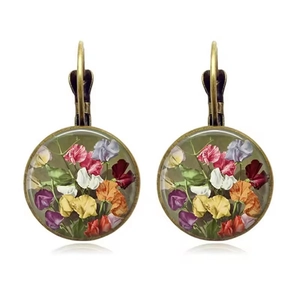 Detailed view of vintage French hook earrings featuring colorful rose floral patterns